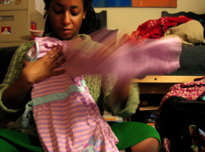 woman folding clothes