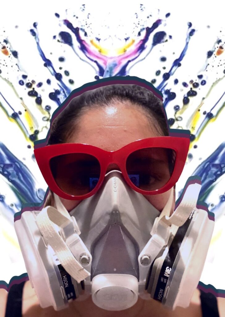 Kate Ackerman wearing industrial safety mask and fashion sunglasses as a protective measure while hand dyeing apparel for her Etsy shop, Yuiitsu Dye Shop