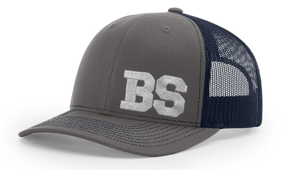 Grey Richardson 112 trucker hat with navy mesh back showcasing custom embroidered initials B and S in white thread
